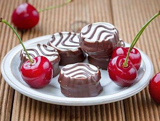 Swiss cookies with ripe cherries